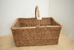 A woven-wicker basket, of traditional rectangular form with over-handle 43cm wide