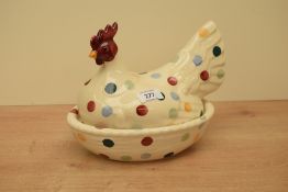 An Emma Bridgewater pottery Hen on Nest, decorated in a polka dot pattern with printed black factory