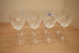 A group of eight Waterford crystal wine glasses, with hob-nail and cut window decoration, marked