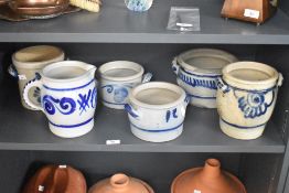 A selection of 20th-century German studio stoneware pottery, having an off white base, decorated