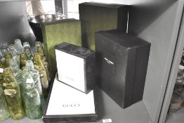 A collection of five modern designer display boxes, including Gucci and Saint Laurent, (5).