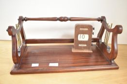 A mid 20th century oak perpetual rolling desk top calendar, 14cm. Sold together with reproduction