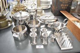 A collection of 12 late 20th-century Old Hall stainless steel tableware, featuring, for exmaple, two