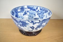A large contemporary Chinese pottery bowl, with goldfishes and foliage inside and outside, unmarked,