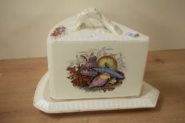 A Victorian pottery cheese dish and cover, of wedge shape transfer decorated with seashells 29cm