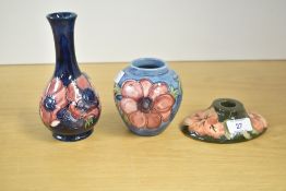 A collection of 20th century Moorcroft pottery, compromising of an Anenome design long neck bud vase