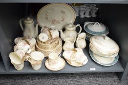 A Royal Doulton 'Lisette' fine bone china dinner service, to include tea pot, coffee pot and cream