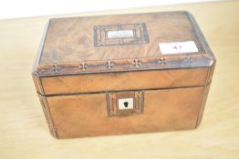 A Victorian walnut tea caddy with two compartments, featuring an inlaid mother-of-pearl