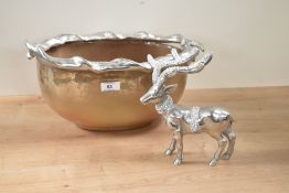 A large modern glass and metal decorative bowl, featuring a stag horned rim, sold with a metal white