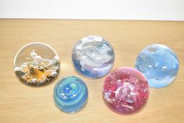 A selection of five Caithness Scotland studio art glass paperweights, featuring 'Sirocco', '
