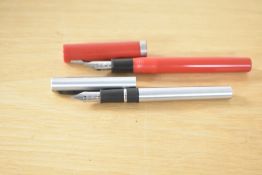 Two Sheaffer cartridge fill fountain pens. A No Nonsense in Red and a Brushed steel