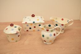 A group of four Emma Bridgewater pottery polka dot design items, butter dish, preserve pot gravy