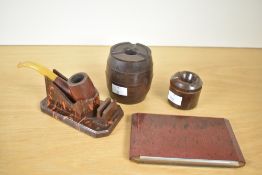 A collection of 20th century Bakelite smoking accessories, featuring a Velos 'Non-Smoker' and a