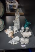 A Lladro style porcelain figurine of a lady in dress, h24cm, sold together with a Neo dog figure and