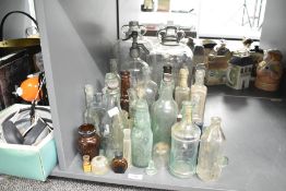 A group of early 20th century glass bottles, to include a Noble's Carlisle and Cochran & Co