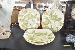 A set of 6 1950s Red Wing plates of oval form, decorated with floral patterns on a magnolia