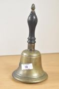 A 19th century traditional brass hand bell with a dark wooden handle, complete with clapper, 23.5cm