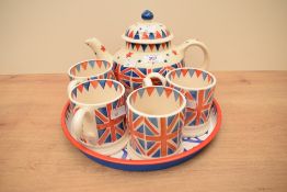 An Emma Bridgewater Union Jack pattern teapot and four mugs, and sold together with an Emma