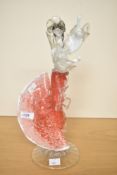 A Murano style hand blown glass figure of a flameco dancer raised on a circular footed base, h34cm
