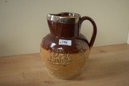 A Victorian stone ware hunting jug in the style of Doulton Lambert pottery, having silver collar rim