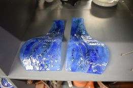 A pair of modern coloured and textured art glass panels, of shaped form, 38cm