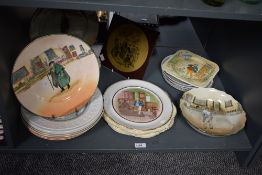 A quantity of Royal Doulton bone china Dickens Series Ware plates.