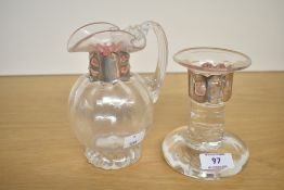 An attractive late 20th-century art glass candle stick and jug, both having a silvered plated copper