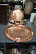 A pair of vintage circular embossed copper Johnnie Walker whisky trays, 33.5cm sold along with a a
