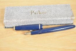 A boxed Parker Slimfold fountain pen in Blue with decorative cap band having Parker 14k England 5