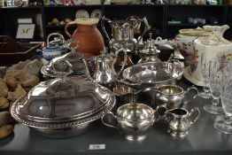 A pair of American silver-plated lidded serving dishes, of domed circular form with gadrooned edge