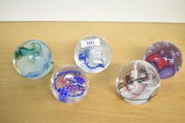 A selection of five Caithness Scotland studio art glass paperweights, featuring 'Ribbons', '
