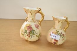 Two Royal Worcester 'Blush Ivory' cream jugs, hand painted with floral designs, h13cm.