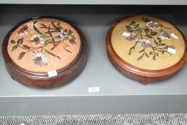 Two Victorian beadwork foot stools, each of circular padded form decorated with foliate designs,
