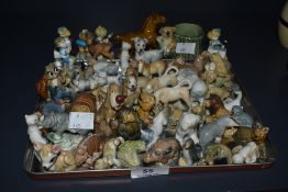 A collection of Wade whimsies porcelain figures, including a Koala egg cup, a larger horse, and five