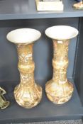 A pair of 19th century Japanese Satsuma ware vases, featuring a flared rim, slender neck and a