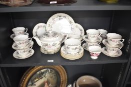 A Royal Worcester 'June Garland' pattern tea service, having gilt edges and floral motifs, to