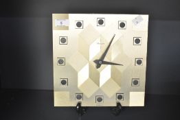 A West German Time Master, gilt geometric design clock circa 1980's with quarter movement. 24cm