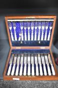 A set of 12 Victorian silver plated and mother of pearl fruit knives and forks, in an unmarked