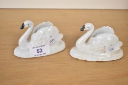 A pair of late 19th/early 20th century white painted cast iron Swan form match book holders,