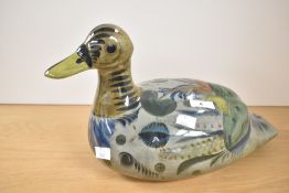 A large Mexican folk art pottery duck, hand decorated with flora and fauna design. Unsigned. 38cm