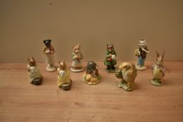 A group of nine Beswick Pottery Beatrix Potter characters to include 'Pickles' gold back stamp, '
