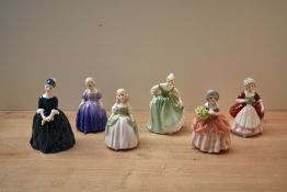 A group of six Royal Doulton bone china figurines comprising 'Marie' HN 1370, 'Penny' HN 2338, '