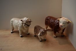 A group of three Melba Ware pottery cow studies.
