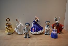 A group of five Royal Doulton bone china figurines comprising 'Marie' HN 1370, 'Carol' HN 2961, '