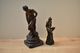 A heavy patinated metal figurine sold with a similar speltre figurine, largest on marble style
