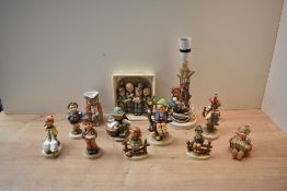 A group of twelve Goebel porcelain figures/figurines to include 'Choir Boy' and 'Goose Girl'.