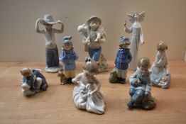 A group of nine Lladro and Nao by Lladro figures/figurines to include 'Nun' model number 5501 etc.