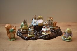 A group of seven Beswick Pottery and Royal Albert Beatrix Potter character studies to include '