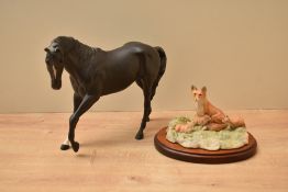 A Royal Doulton bone china horse study in matt black finish sold together with Border Fine Arts