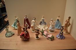 A large selection of Royal Doulton, Coalport and similar figurines to include Royal Doulton bone
